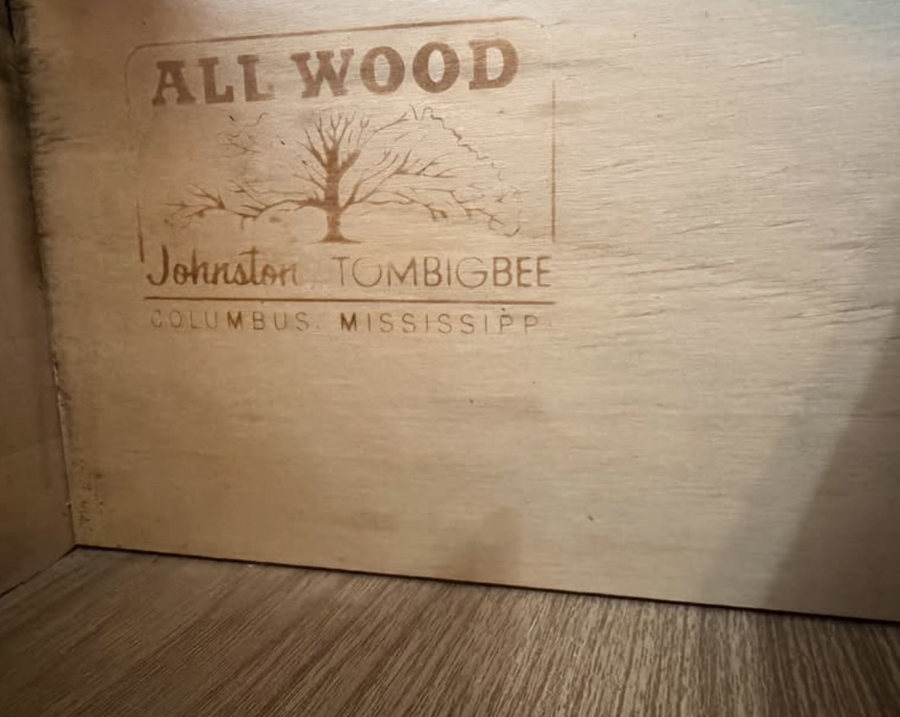 A stamp reading All Wood with a bare tree, Johnston Tombigbee, Columbus, Mississippi, on the inside of a dresser case